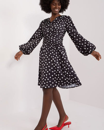Robe cocktail à pois élégante
